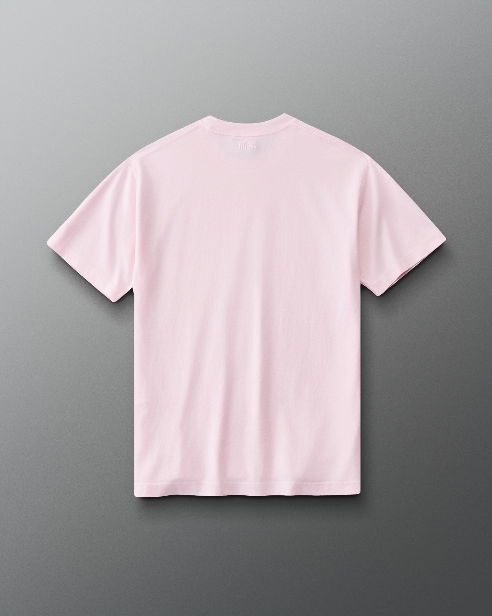 Back view of the RUDIS Wonder Woman Girl Power Relaxed Cotton T-Shirt in washed pink, showcasing the clean back design, subtle RUDIS branding below the collar and relaxed silhouette.