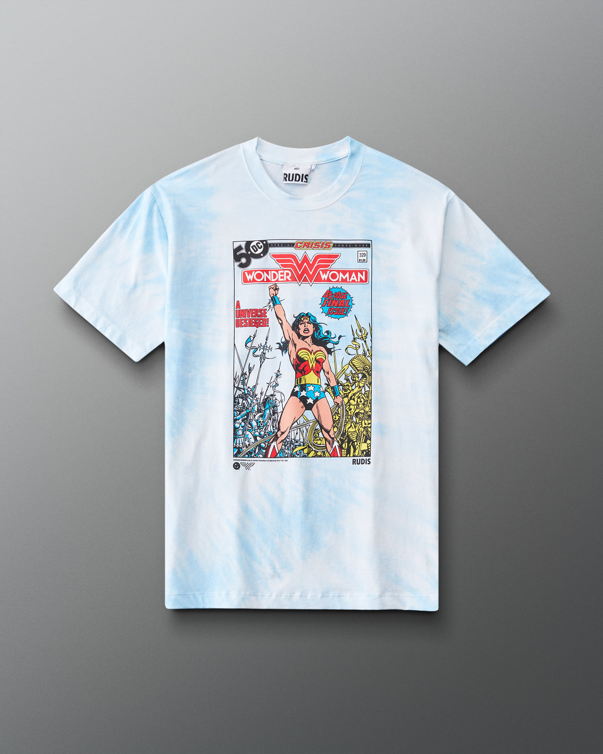 Front view of RUDIS Wonder Woman Comic Relaxed Cotton T-Shirt in blue tie dye, featuring a crew neckline, short sleeves and bold DC Comics Wonder Woman cover artwork.