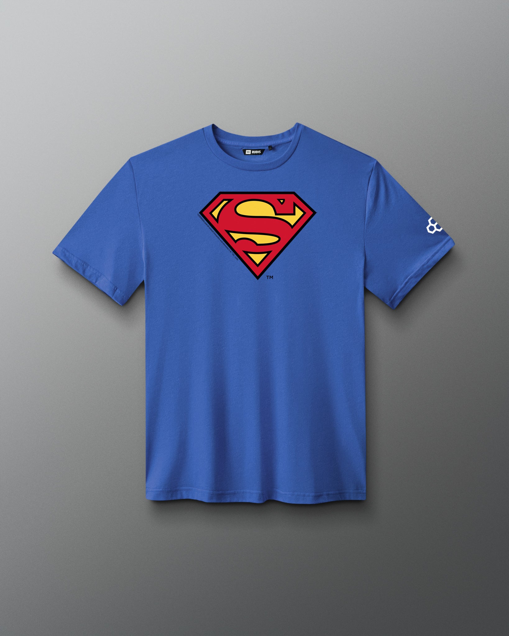 RUDIS Superman Icon Elite Supersoft T-Shirt in royal blue featuring the classic red and yellow Superman shield graphic.