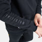 A close-up view of a childs black hoodie featuring the word WRESTLING printed vertically on the left sleeve with a casual stance highlighting comfort and style