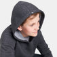 A young boy wearing a gray hoodie with a slight smile looking to the side showcasing the casual and cozy design of the garment
