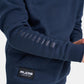 A close-up of a navy blue hoodie featuring the word WRESTLING printed along the sleeve and a logo patch from RUDIS on the front