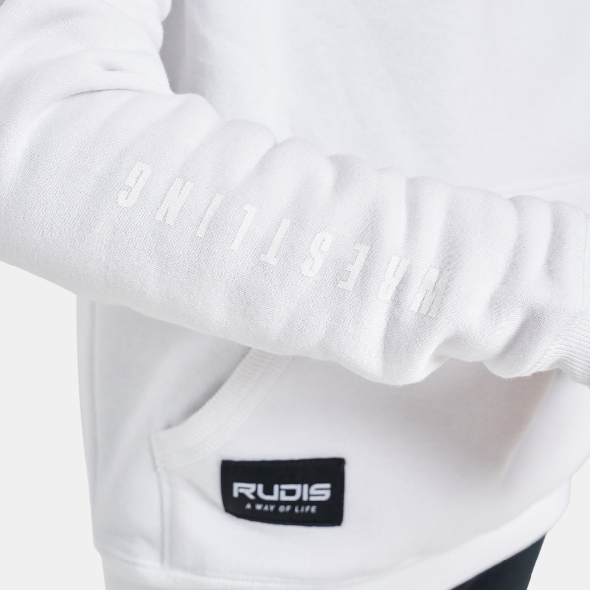 A close-up view of a white hoodie featuring a prominent Wrestling print on the sleeve and a stylish brand label ideal for sport enthusiasts