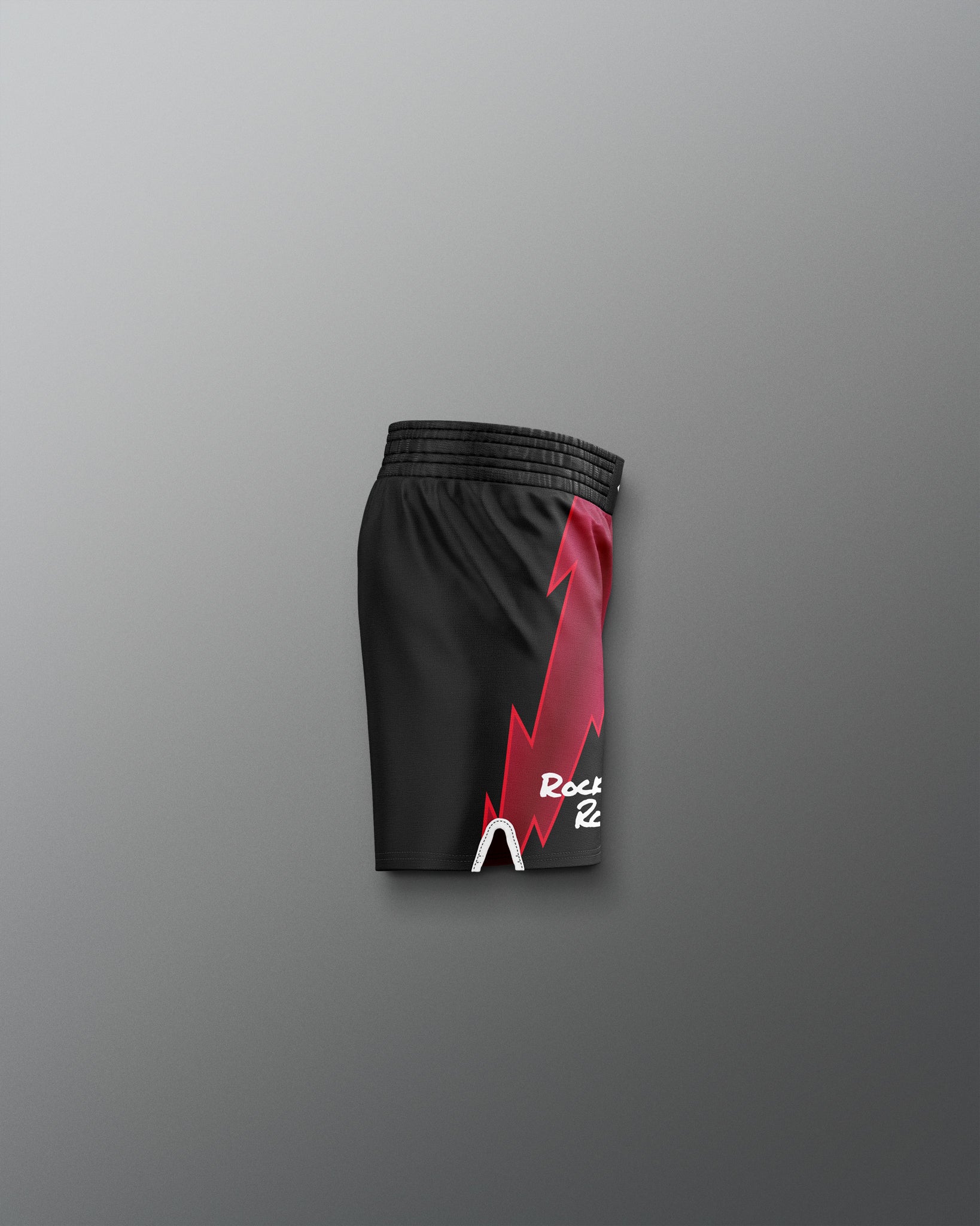 Black shorts with a red and white logo on a gray background