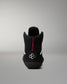 Black wrestling shoe with a brand logo on a gray background