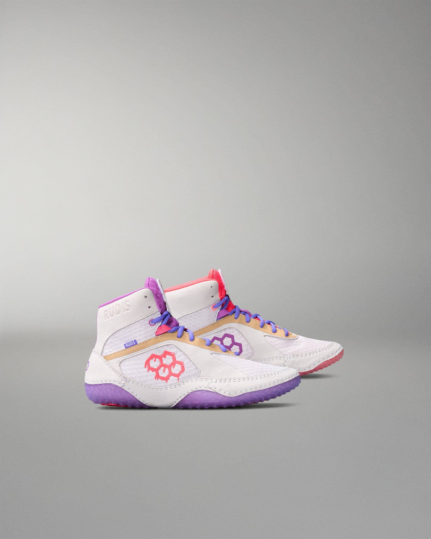 White wrestling shoes with colorful accents on a gray background
