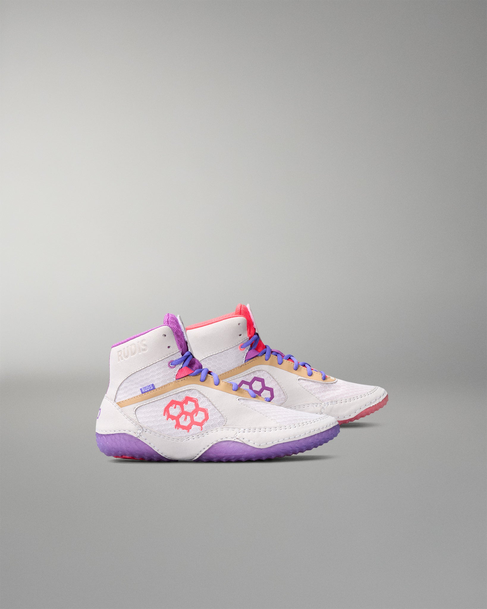 White wrestling shoes with colorful accents on a gray background
