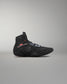 Black wrestling shoe on a gray background