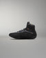 Black wrestling shoe on a gray background