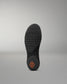 Black sole of a wrestling shoe with a unique tread pattern on a gray background