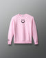 Pink sweatshirt with a smiley face design on a gray background
