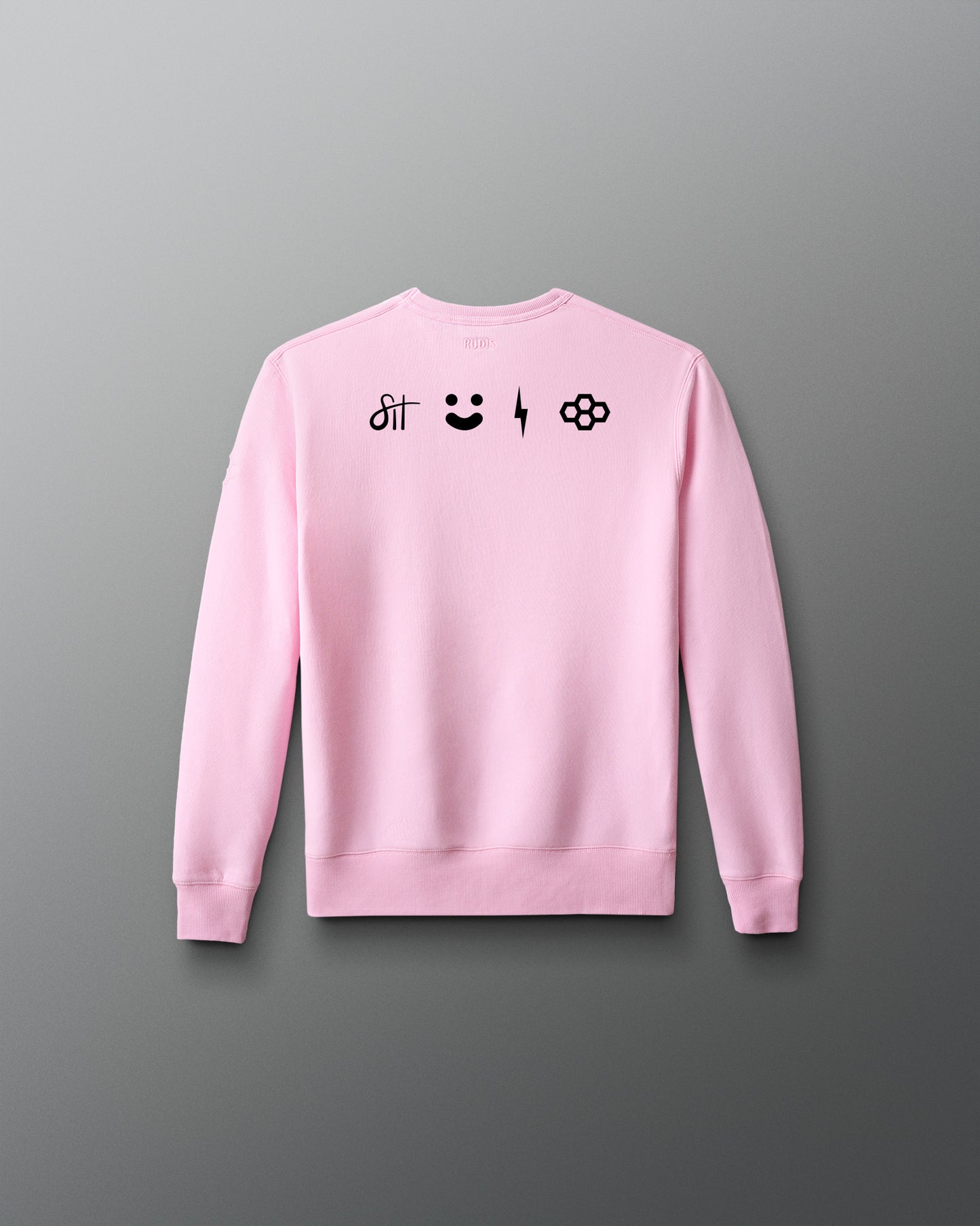 Pink sweatshirt with black designs on the back against a gray background