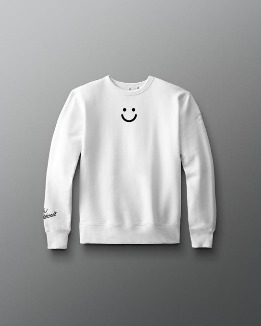 White sweatshirt with a smiley face design on a gray background