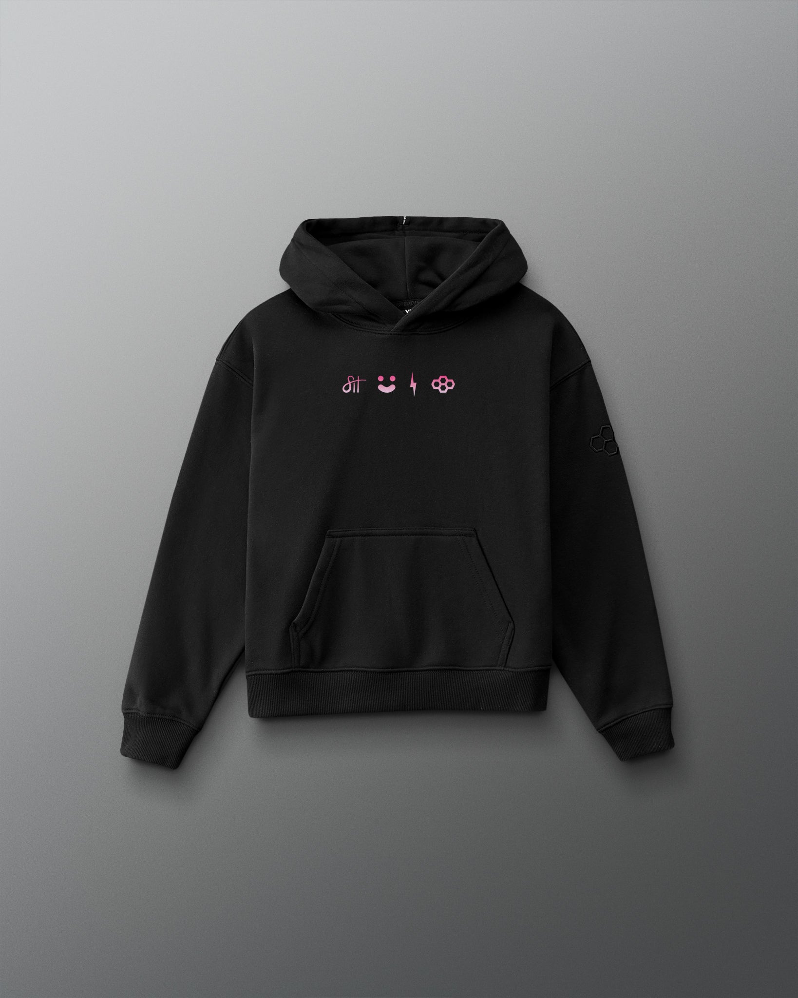 A black pullover hoodie with a small chest graphic featuring pink and white symbols, displayed against a dark gray gradient background.