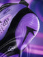 Close-up of a black and purple wrestling shoe with a prominent brand logo on a dark background