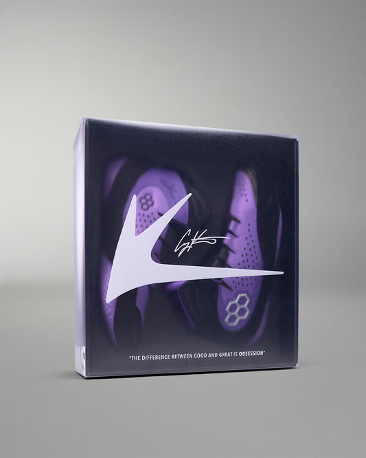 shoe box with purple wrestling shoes and a logo on a gray background