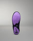 Purple and black wrestling shoe sole on a gray background