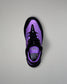 Purple and black wrestling shoe on a gray background