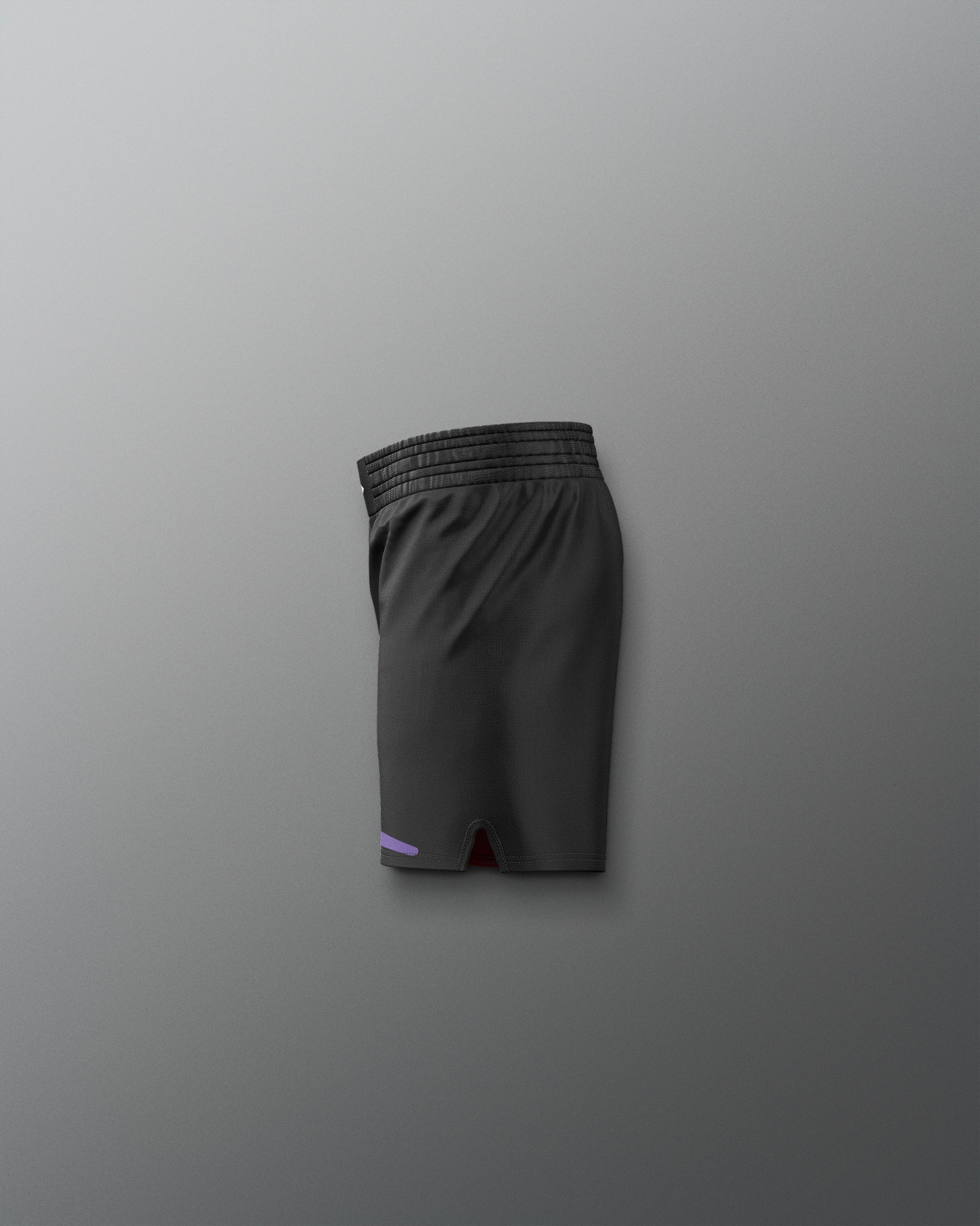 Black athletic shorts on a gray background