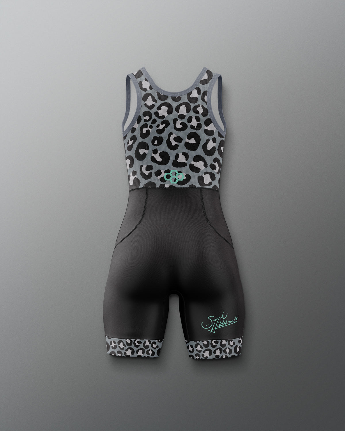 A women's Wrestling singlet against a gray gradient background. The top is a gray racerback with a black and white leopard print, featuring a small mint green Quadhex logo at the center.