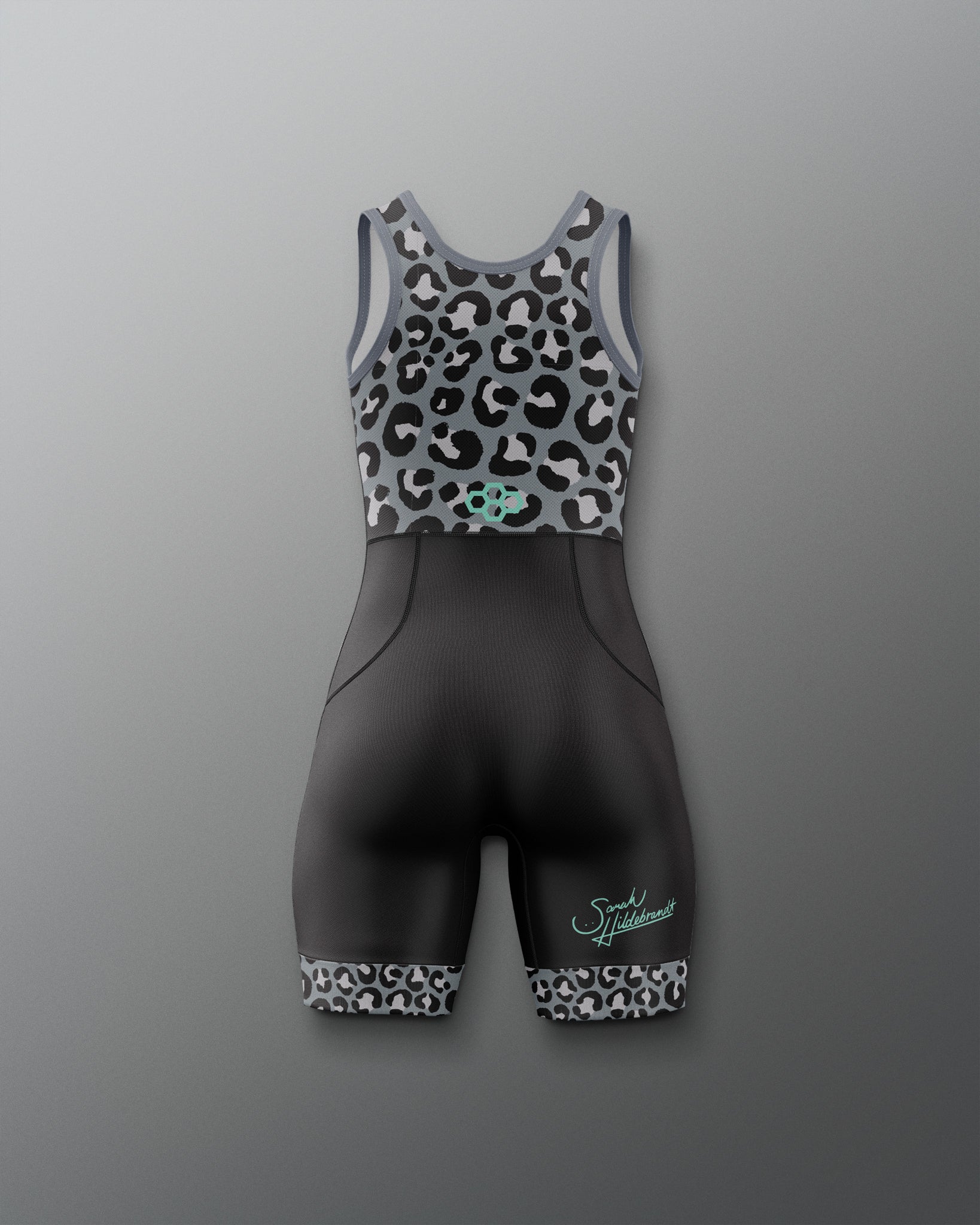 A women's Wrestling singlet against a gray gradient background. The top is a gray racerback with a black and white leopard print, featuring a small mint green Quadhex logo at the center.