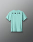 Light blue t-shirt with black symbols on the back against a gray background