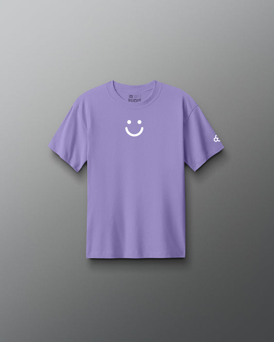 Purple t-shirt with a smiley face design on a gray background