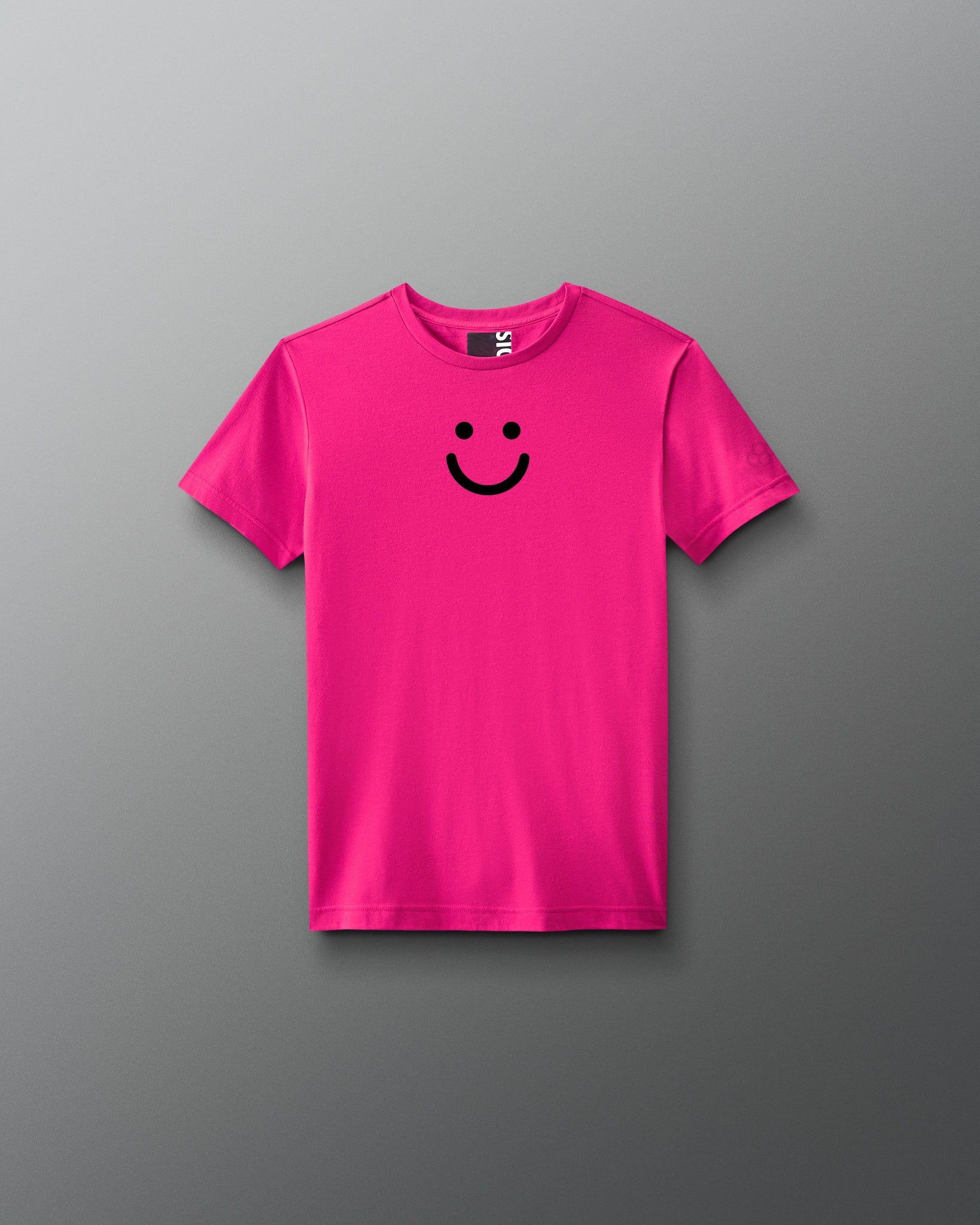 Pink t-shirt with a black smiley face on a gray background