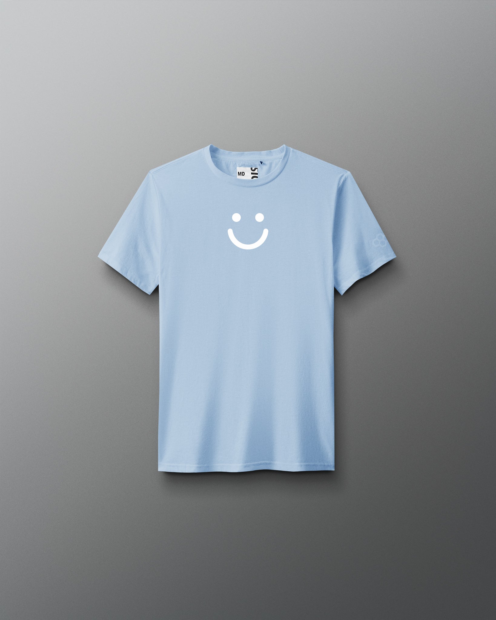 Light blue t-shirt with a smiley face design on a gray background