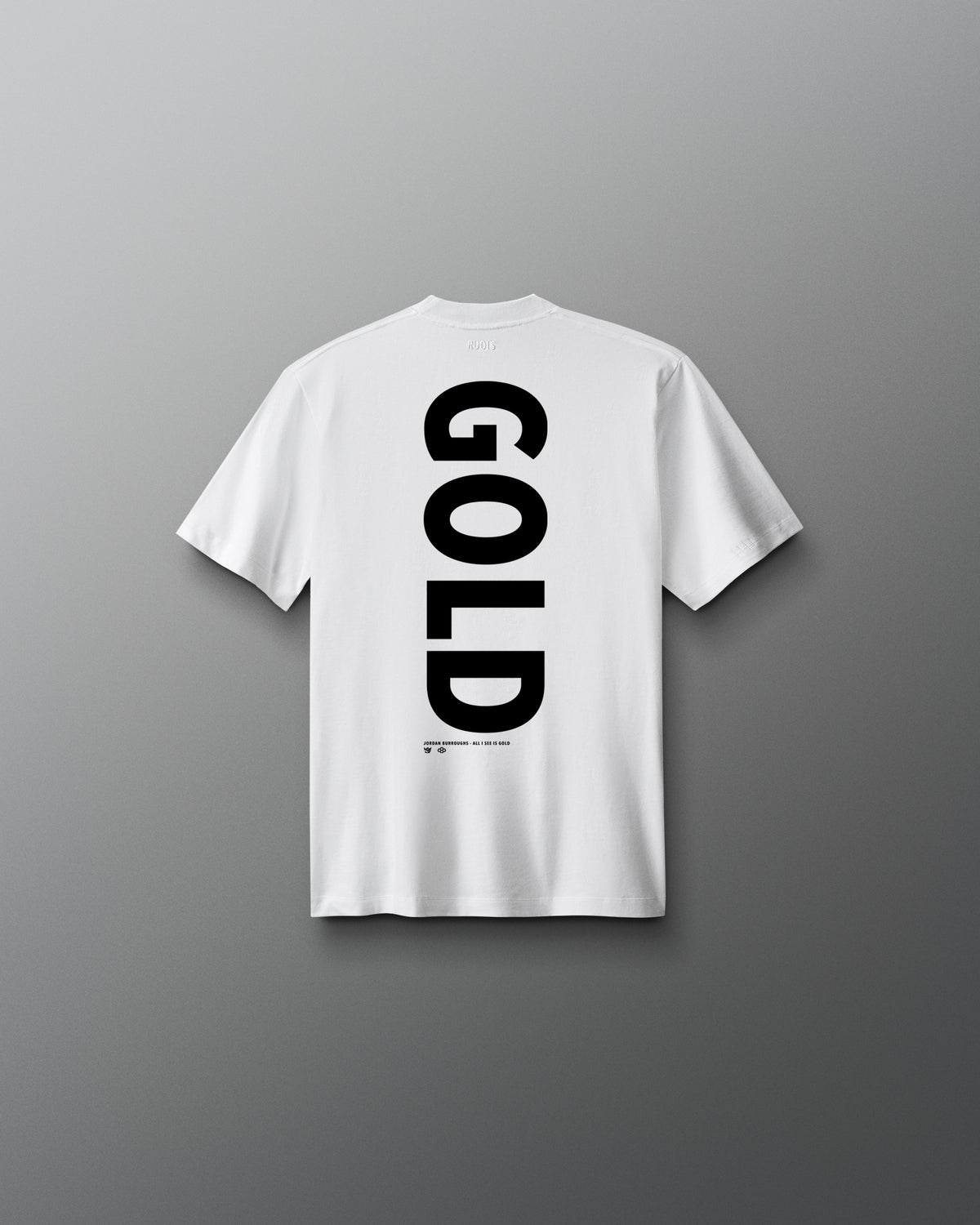 Back view of the white RUDIS Youth JB Gold Heavyweight T-Shirt featuring oversized vertical black “GOLD” lettering with Jordan Burroughs and RUDIS details beneath the graphic.