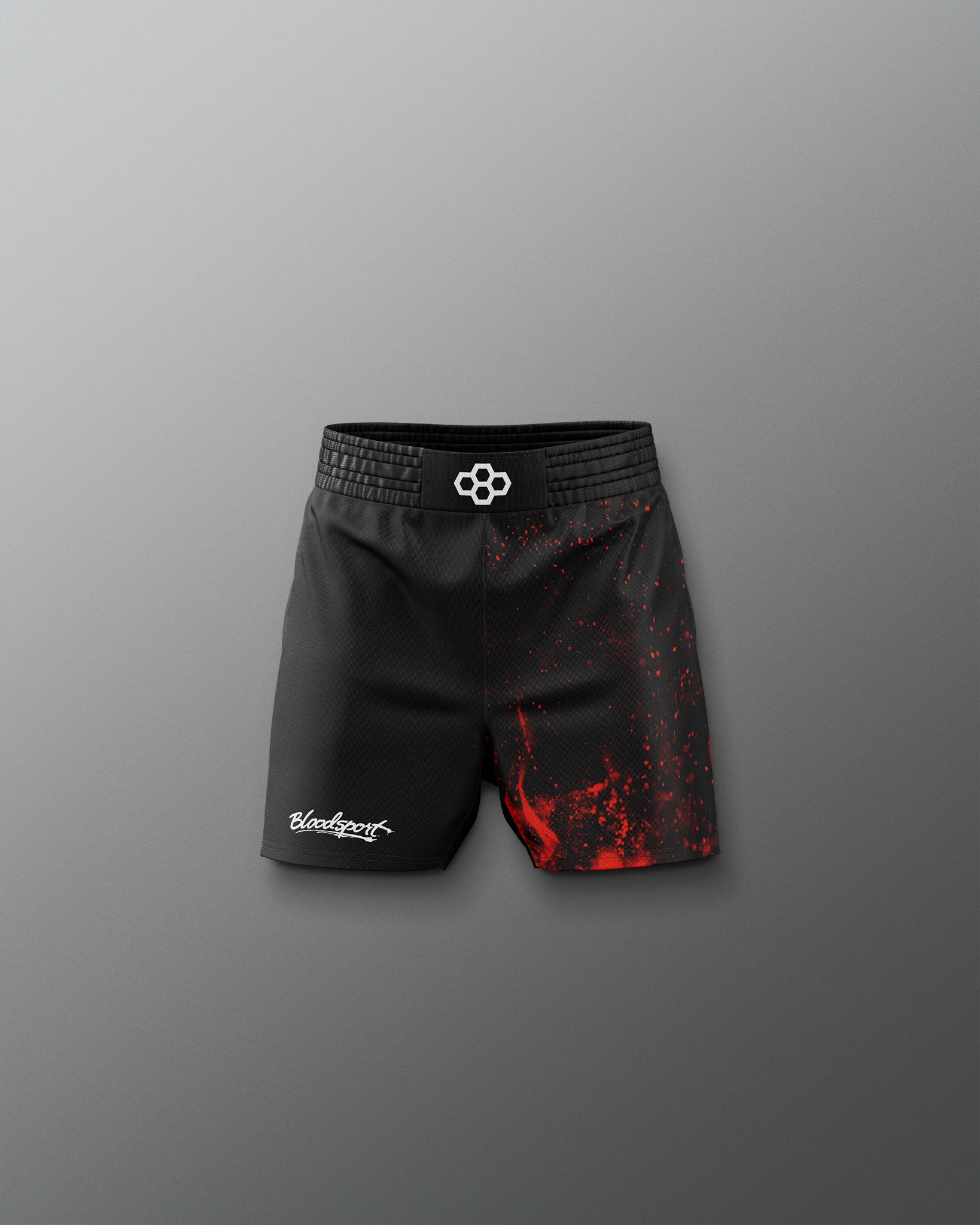 Black and red shorts with a brand logo on a gray background