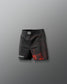 Black athletic shorts with red design on a gray background