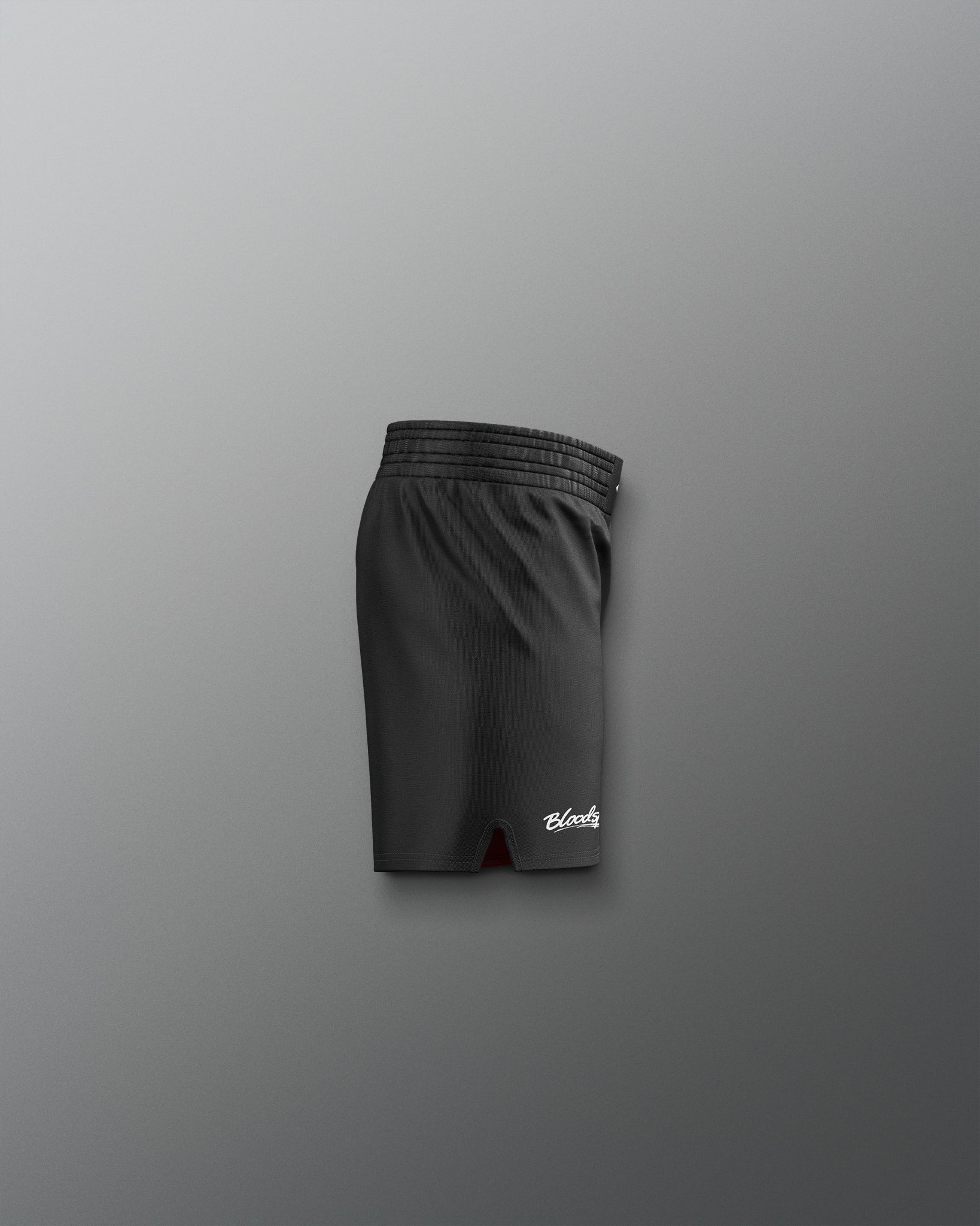 Black shorts with a brand logo on a gray background
