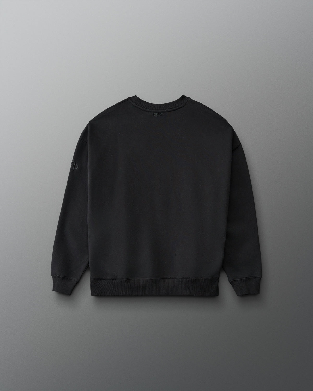 RUDIS Iowa Hawkeyes Youth Relaxed Comfort Fleece Crewneck in Black, back view showing a clean solid black design, ribbed cuffs and hem, and subtle RUDIS branding.