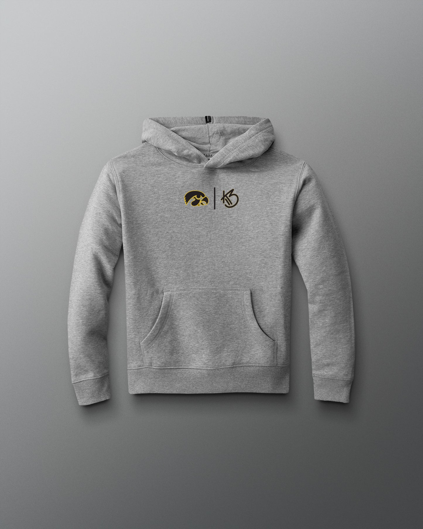 Gray hoodie with embroidered designs on a gray background