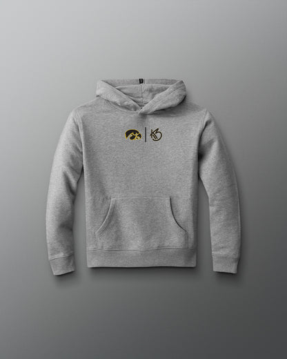 Gray hoodie with embroidered designs on a gray background