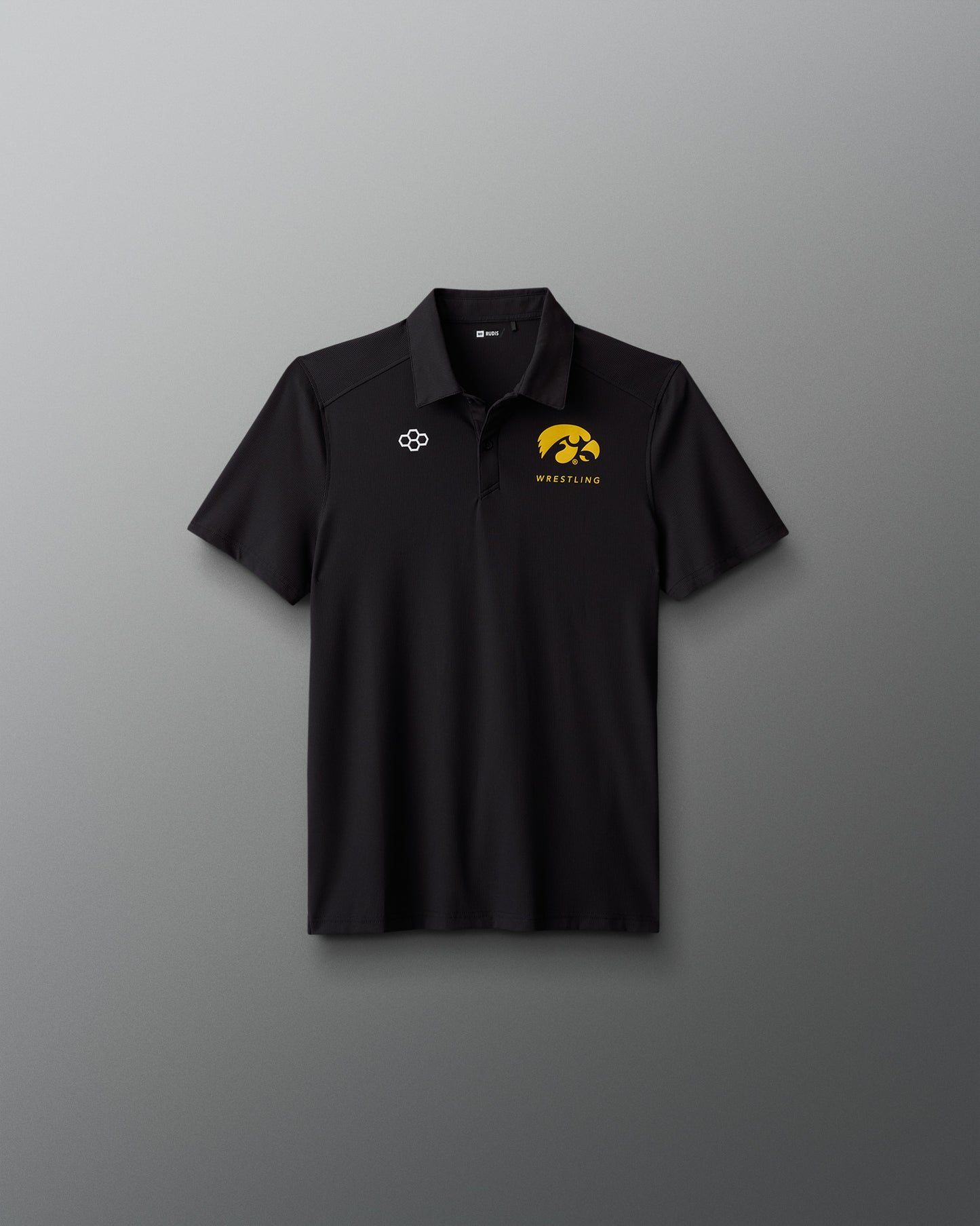 Black polo shirt with logos on a gray background