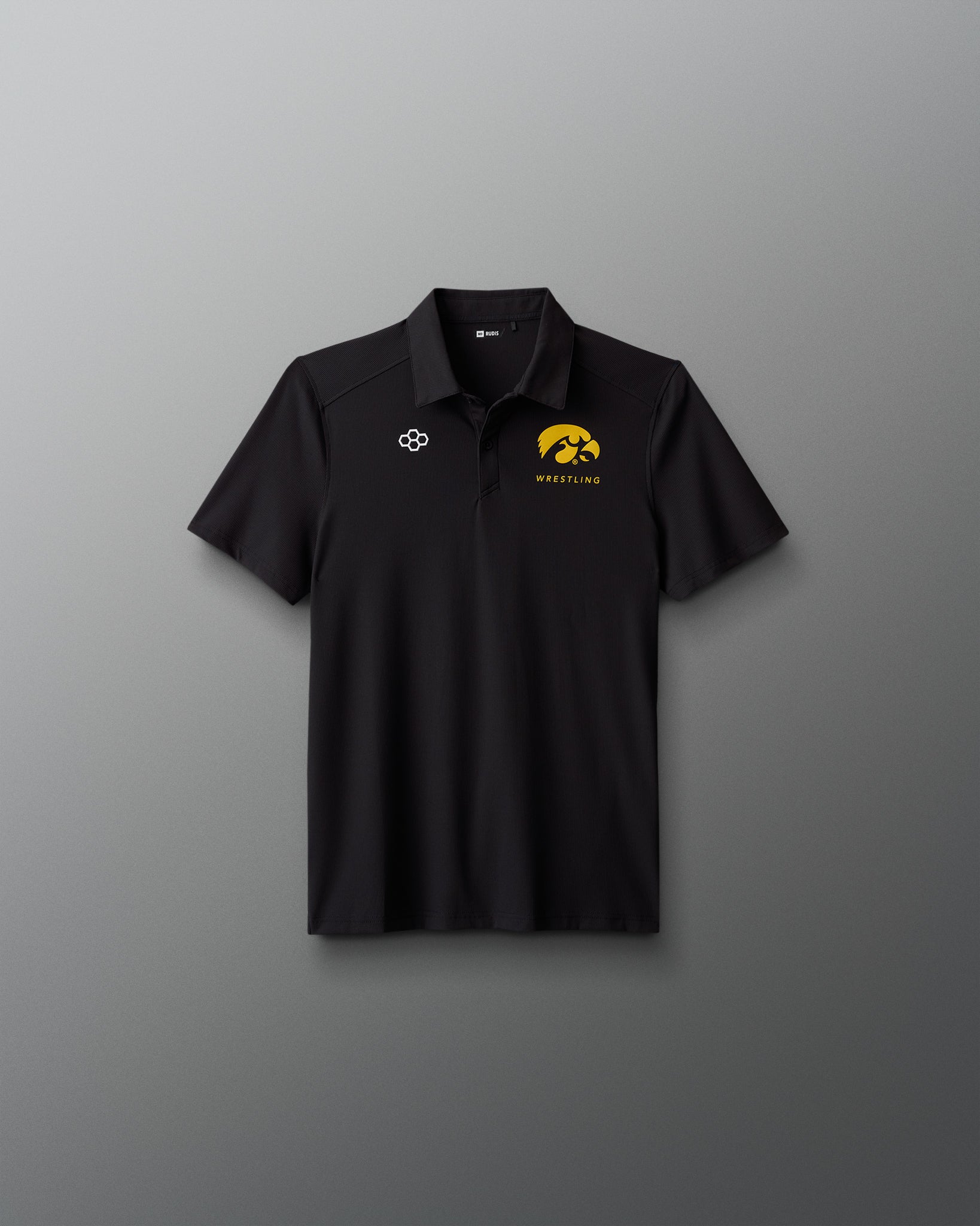 Black polo shirt with logos on a gray background