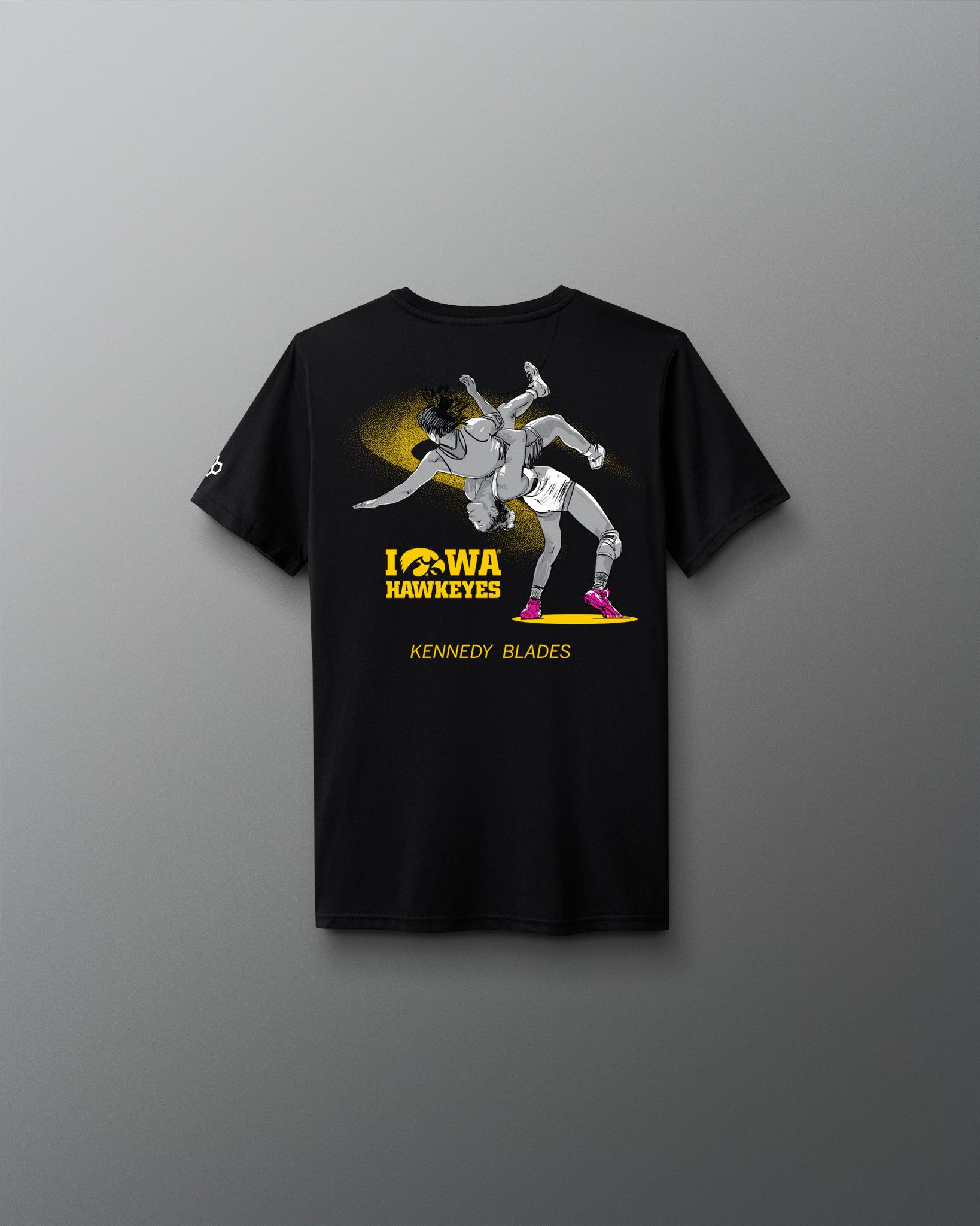 Black t-shirt with wrestling graphic and 'Iowa Hawkeyes' text on a gray background