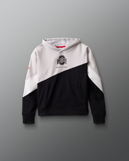 Two-tone black and white hoodie with a logo on a gray background
