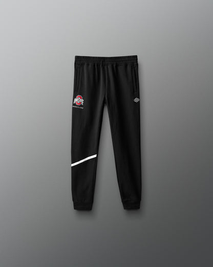 Black sweatpants with logos on a gray background