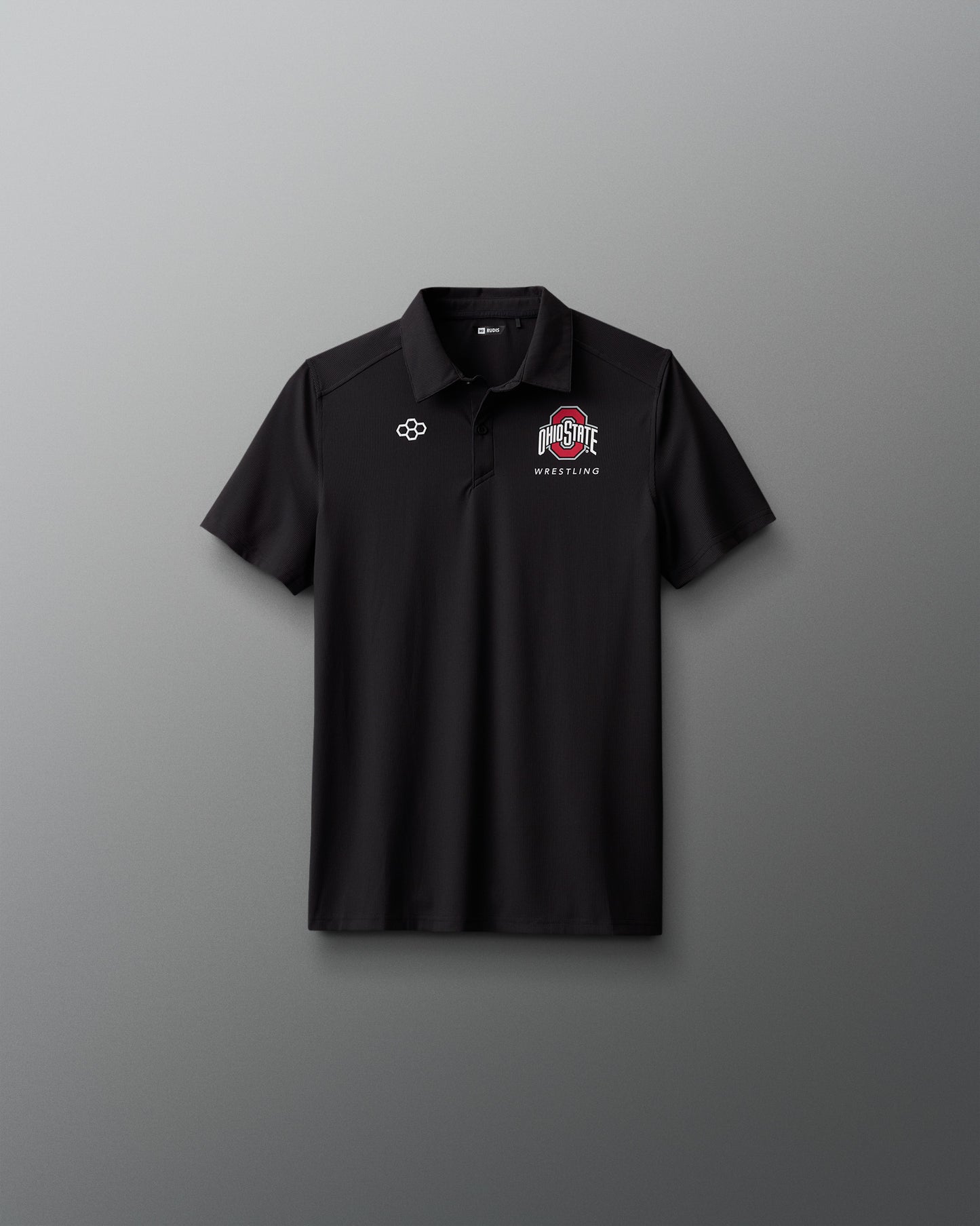 Black polo shirt with logos on a gray background