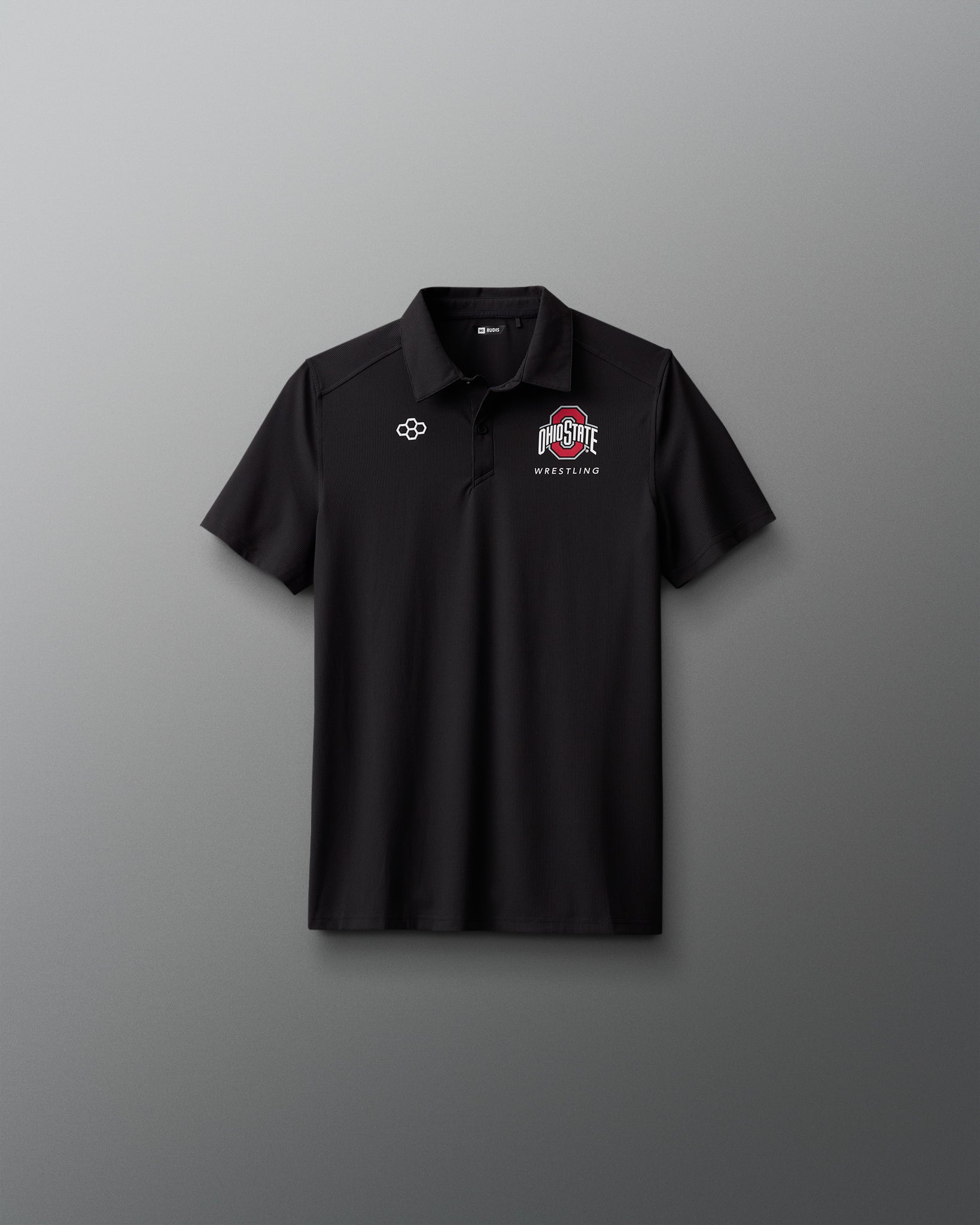 Black polo shirt with logos on a gray background