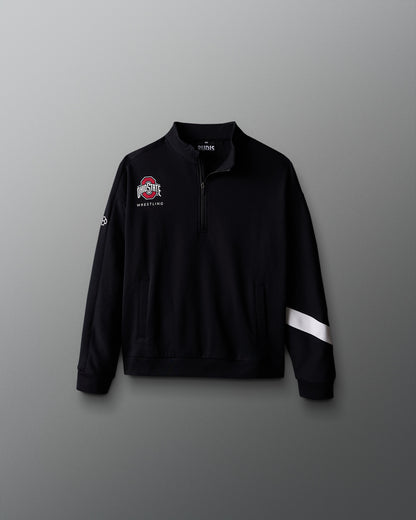 Black quarter-zip sweatshirt with logos on a gray background