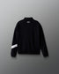 Black jacket with white stripe on sleeve against a gray background