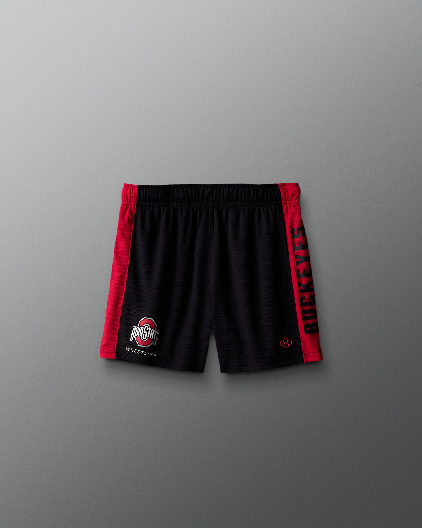 Black shorts with red accents on a gray background