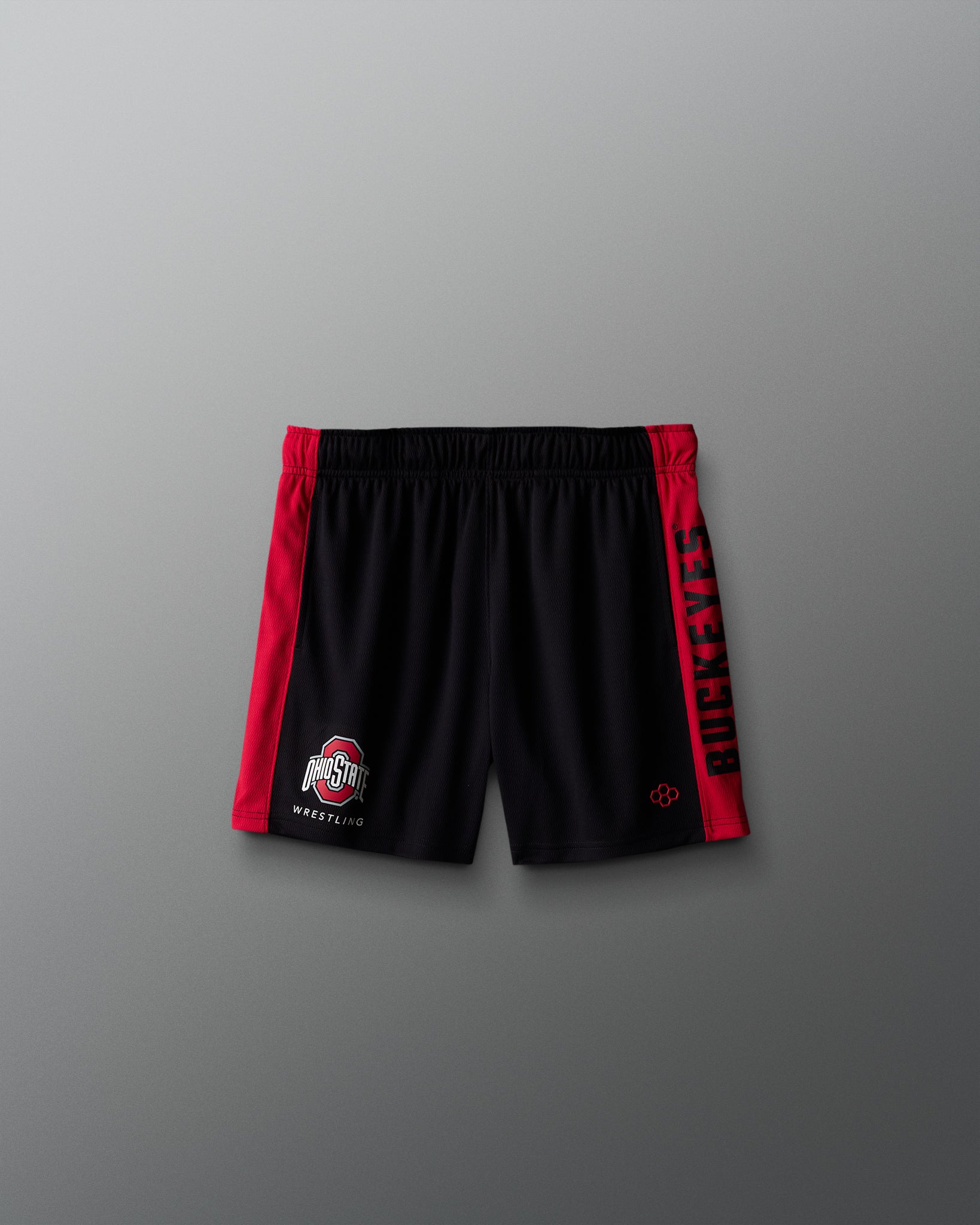 Black shorts with red accents on a gray background