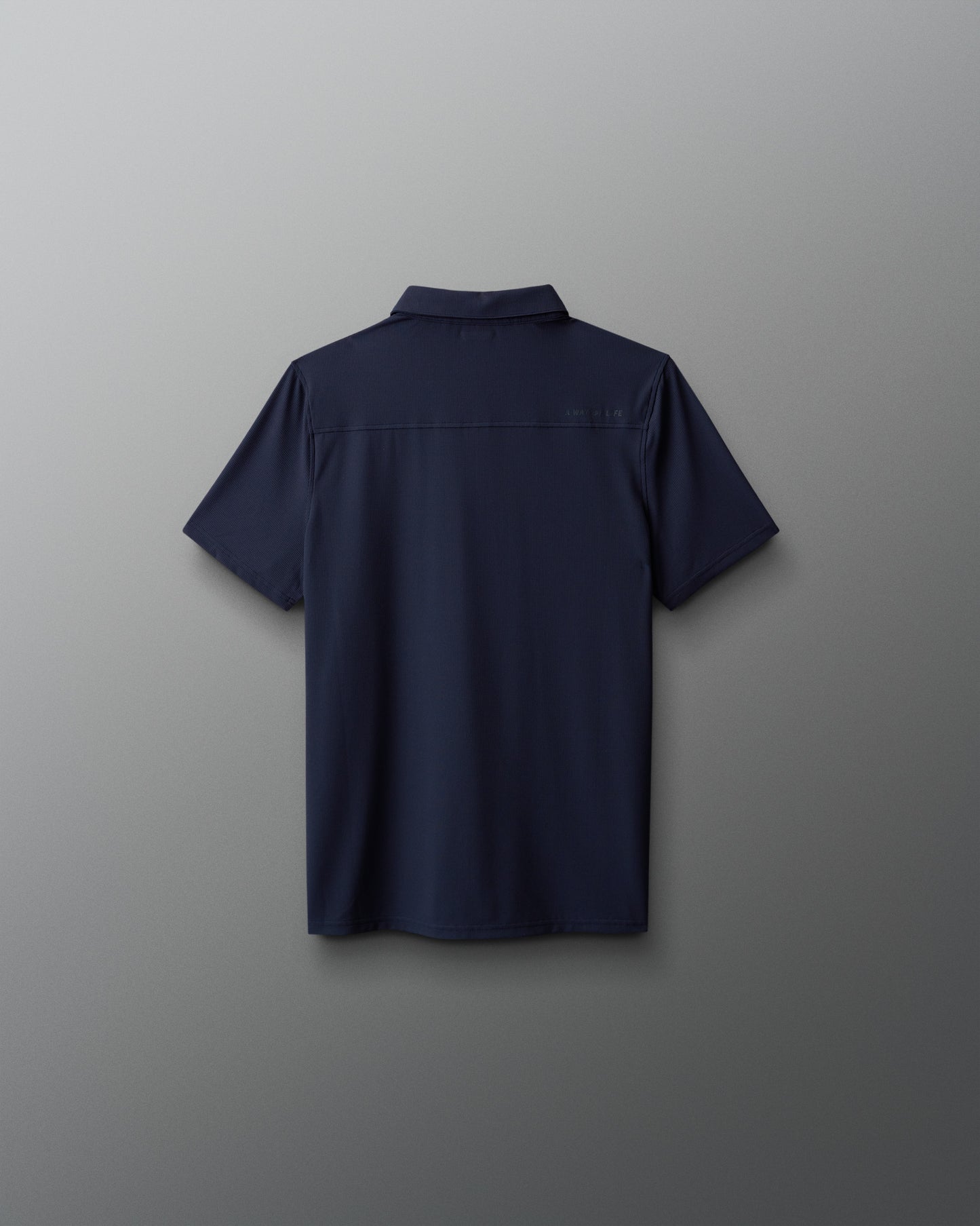 Navy blue polo shirt on a light gray background