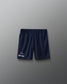 Navy blue shorts with a logo on a gray background