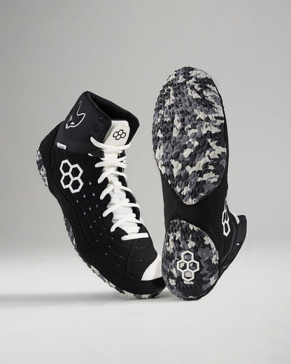 High-top black athletic shoes with white laces and a textured sole designed for performance